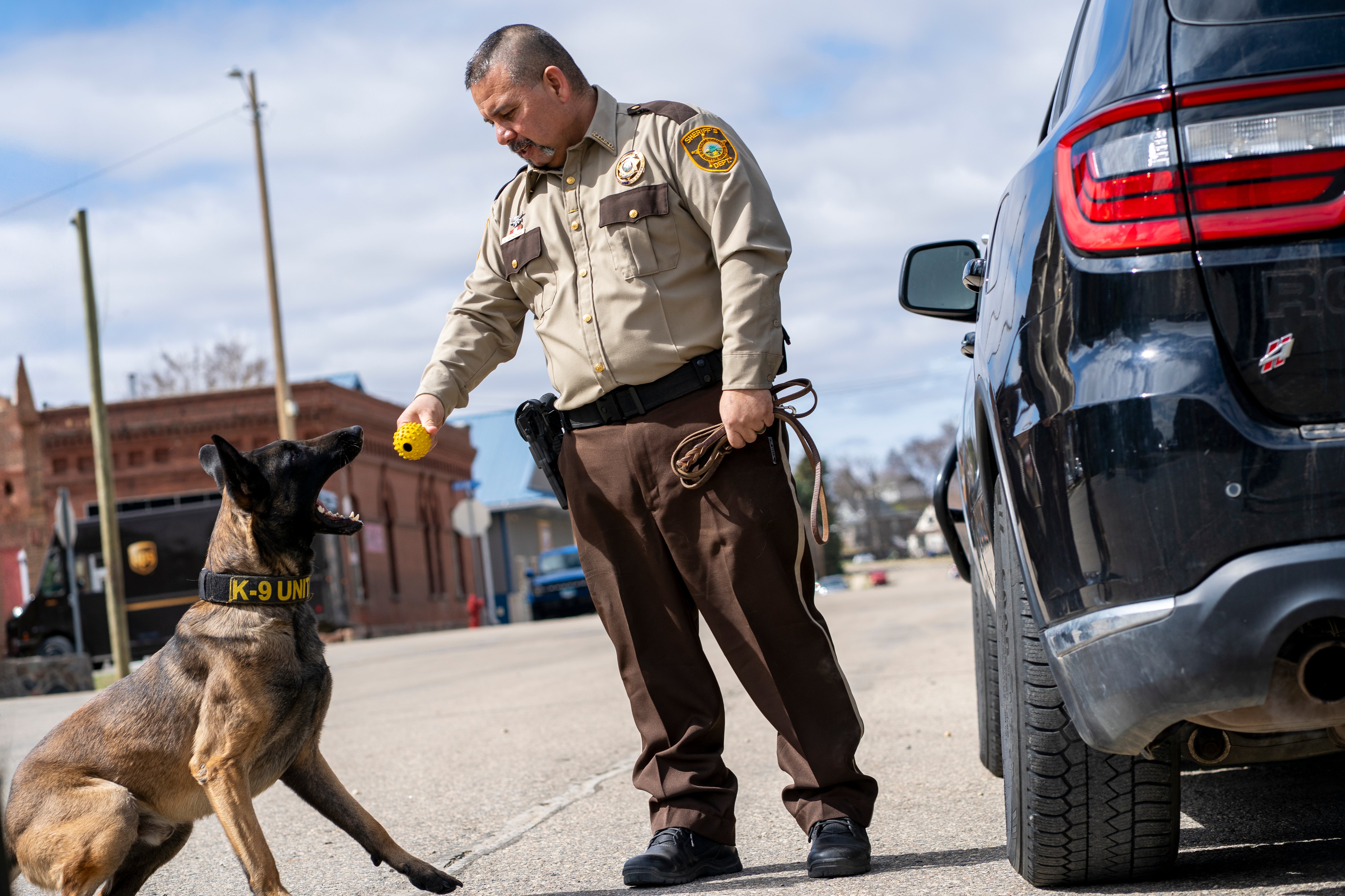 K9 Max with his yellow ball and handler Jorge