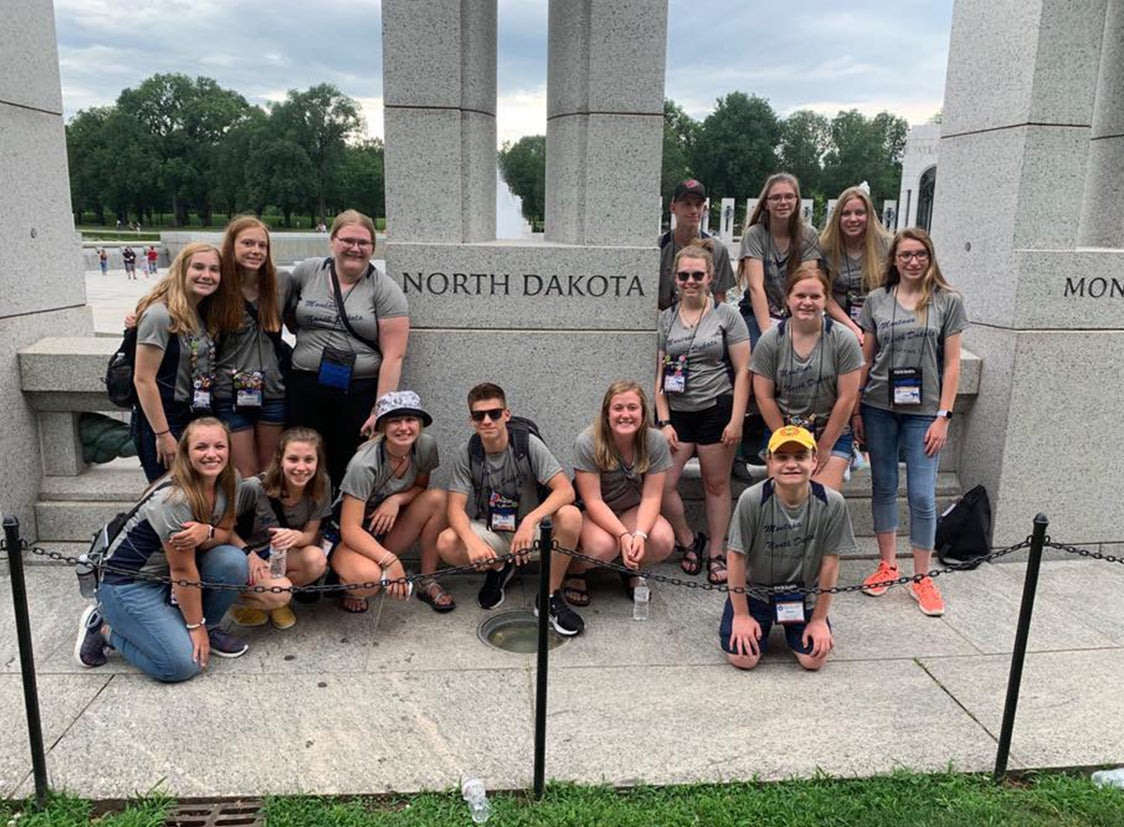 North Dakota youth tour students by North Dakota monument